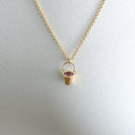 Gold-Bucket-Pendant-Necklace-with-Sapphire-Closeup-On-Model