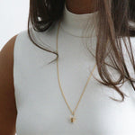 Gold-Bucket-Pendant-Necklace-with-Sapphire-On-Model