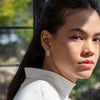 Grey-Spinel-Pave-Huggie-Earrings-On-Model