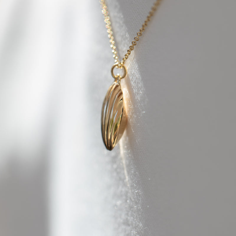 Madeleine-Cookie-Pendant-Necklace-in-Solid-Gold-Side-Closeup